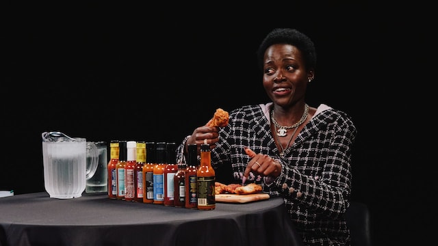 Lupita Nyong’o eats hot wings while discussing her fear of cats and horror films