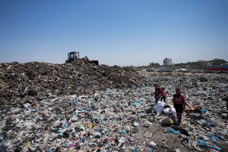 Palestinians face sewage and garbage issues as summer heat continues in Gaza